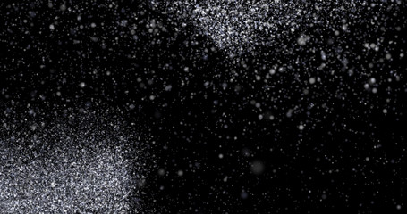 Natural white winter snowfall on a black background
