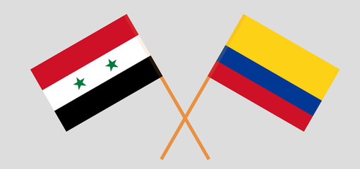 Crossed flags of Colombia and Syria