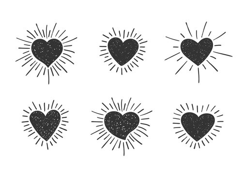 Set of doodle textured heart shapes with retro styled sun rays. Collection of different hand drawn romantic hearts for sticker, label, love logo and Valentines day design.