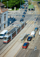 Typical red tram and car transport on Museumstrasse in Vienna