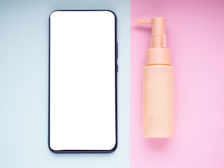 Mock up blank empty smart phone screen on pink beige fashion cosmetic feminine accessory gifts sale flat lay background, online app shopping in mobile ecommerce technology concept, vertical top view