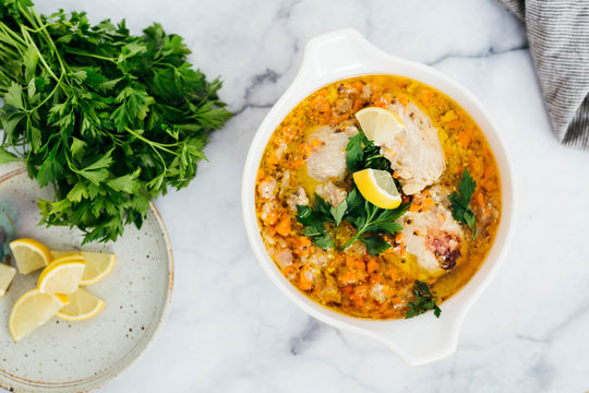 Chicken Escabeche With Fresh Parsley On Marble Background