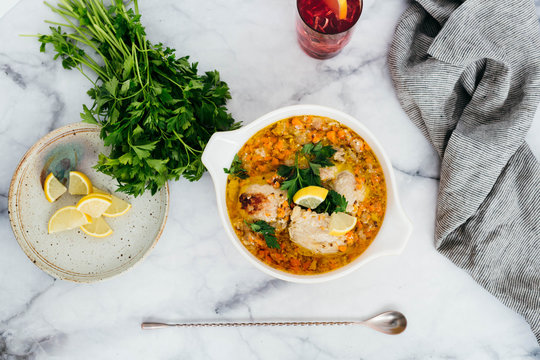 Chicken Escabeche With Fresh Parsley On Marble Background