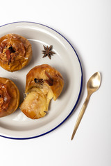 Homemade roasted apples on white background