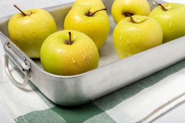 Fresh green apples on white background