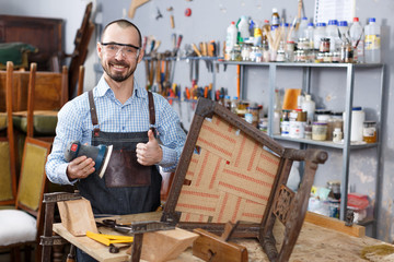 Craftsman holding carpentry tools