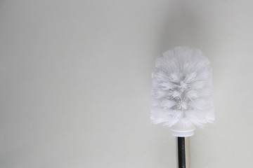 toilet brush in white and silver