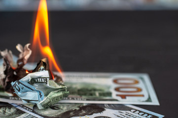 burning dollars close up
