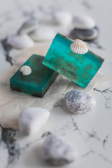 Turquoise handmade soap in the bathroom