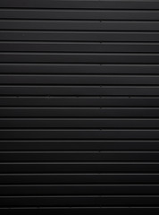 Black Corrugated metal sheet texture surface of the wall. Galvanize steel background.