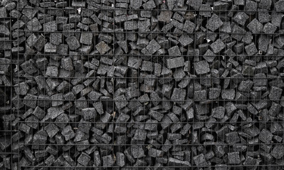 A stone wall that uses metal and stone in harmony. Ecology friendly using a natural resourses for...