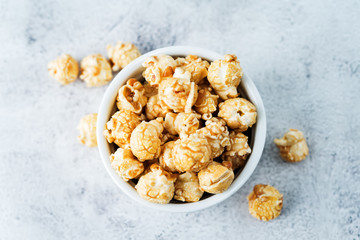 Caramel and chocolate sweet Popcorn in a white bowl