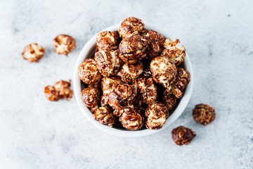 Caramel and chocolate sweet Popcorn in a white bowl