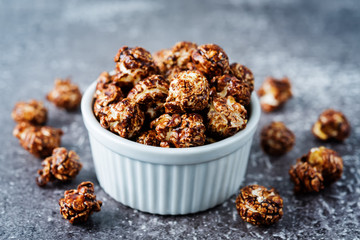 Caramel and chocolate sweet Popcorn in a white bowl