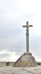 Stone cross in Finisterre on the Camino de Santiago, Galicia, Spain. These symbols were built since the XVII century to sanctify the roads and pilgrims who walk to Santiago.