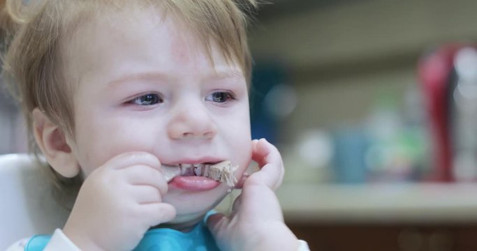 Boy eats lard and rusks