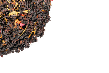 black tea with fruit pieces and flower petals macro isolate