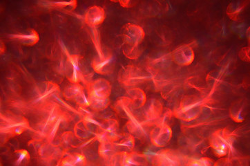 Flickering abstract background with defocused red light