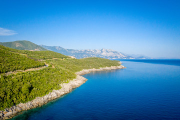 Fototapeta na wymiar Aerial view of sea and fantastic Rocky coast, Montenegro. Shot from air.