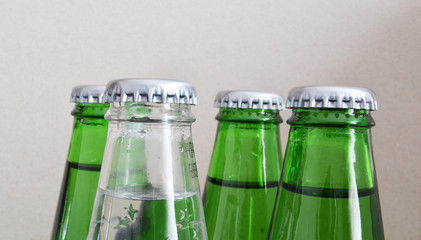 Unopened colored and colorless glass bottles.