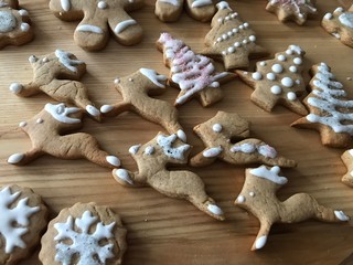 Gingerbread cookies with colorful decoration - gingerbread man, snowflakes, Christmas trees, bears, deers, hearts