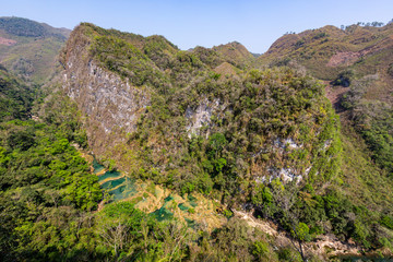 Panorama of the limestone ridge with cascades and waterfalls of Semuc Champey in the Peten jungle and rainforest of Guatemala.