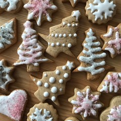 Gingerbread cookies in form of christmas trees with colourful decoration