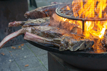 Tomahawk rib steak on hot grill