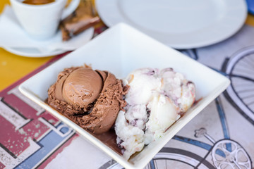 Chocolate and white cream ice cream . Restaurant dessert