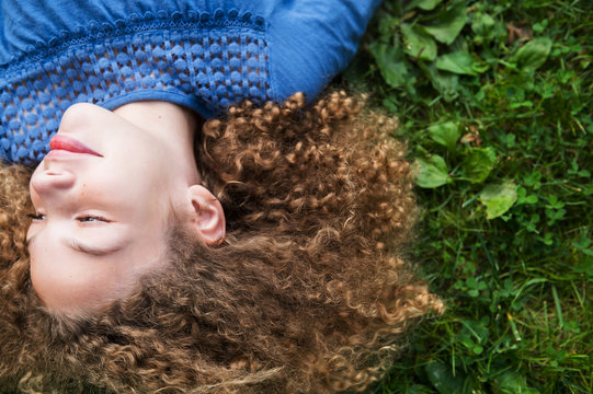 Girl lying on grass
