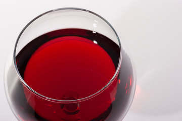 Glass of red wine with shadow.Top view
