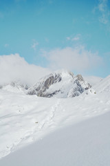Fototapeta na wymiar Snow White Glacier Mountains with Brilliant Blue Sky
