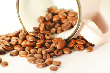 Close-up coffee  beans and a cup isolated on white background, photo