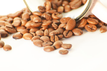 Close-up coffee  beans and a cup isolated on white background, photo