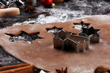Baking christmas cookies. Typical cinnamon stars bakery with spices. xmas decoration on table