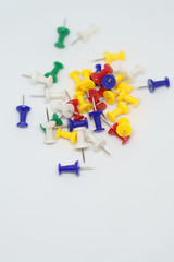 Multicolored stationery buttons on a white background