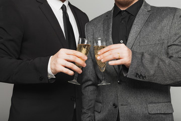 Two men in suits at the LGBTQ wedding