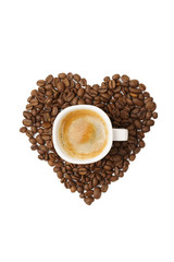 A heart made of coffee beans and a cup of hot coffee.