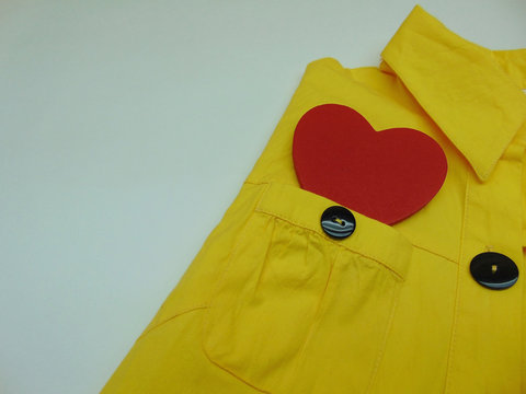 Yellow Shirt With A Pocket In Which A Red 