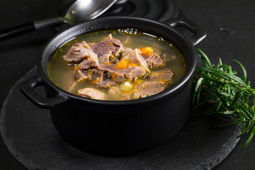 Chicken gizzards stewed with carrot in sauce.