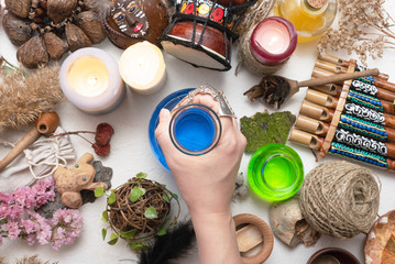 Witch doctor is preparing a magic potion close up.