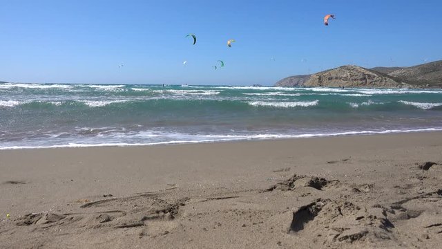 Prasonisi Kite Beach, Mediterranean sea, kite surfers ride on the sea, Rhodes island Greece