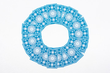 Tarot cards over white table background.