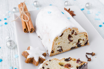 traditional german christmas cake stollen with cookies and decoration