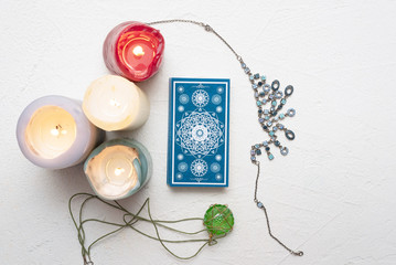 Tarot cards over white table background.