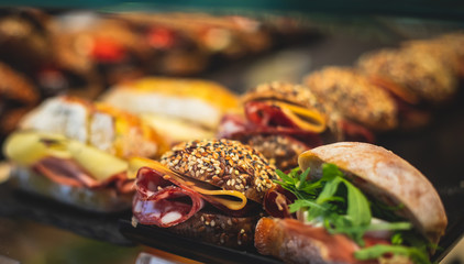 Beautifully decorated catering banquet table with different food snacks and appetizers on christmas birthday party event or wedding celebration, concept of Italian antipasti wine snacks variety set