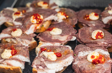 Beautifully decorated catering banquet table with different food snacks and appetizers on christmas birthday party event or wedding celebration, concept of Italian antipasti wine snacks variety set