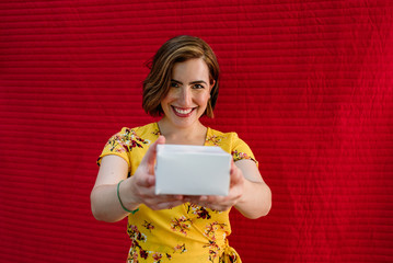 smiling girl with gift in hands