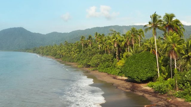 Beach of the Pacific Ocean with rainforest in Choco, Colombia, near Nuqui, drone aerial view