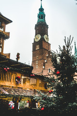 Fototapeta premium Christmas market on main square in city center of Wroclaw with colorful buildings, shops, christmas tree. Wroclaw in christmas time. Travel and tourism in Wroclaw. Christmas celebration concept.